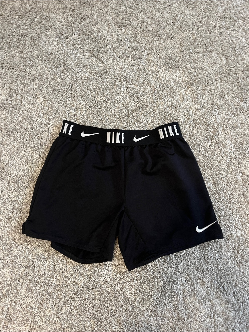 Nike Women's Black Athletic Shorts with White Swoosh and Branded Waistband